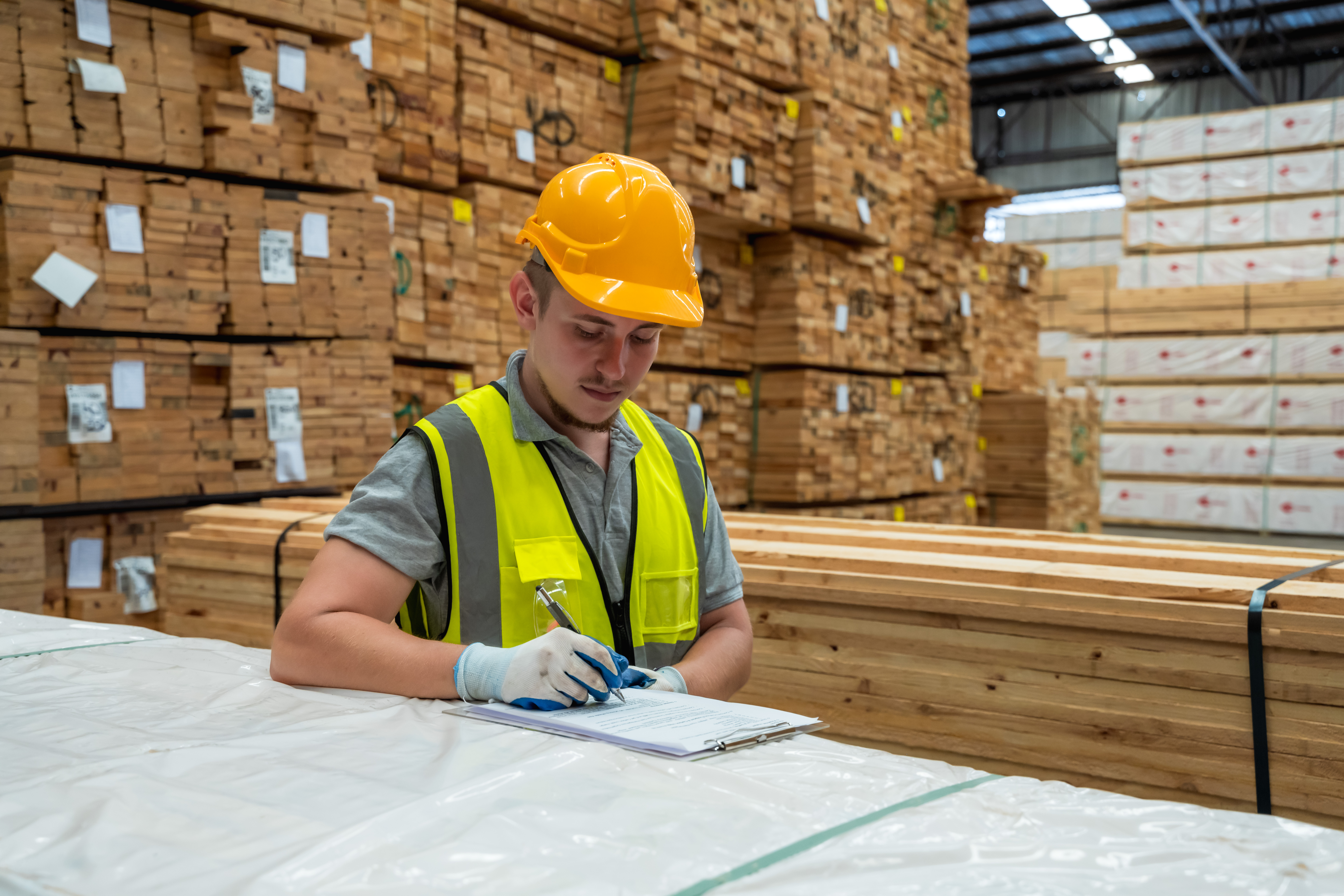 An image of a hardware store warehouse worker taking an inventory.