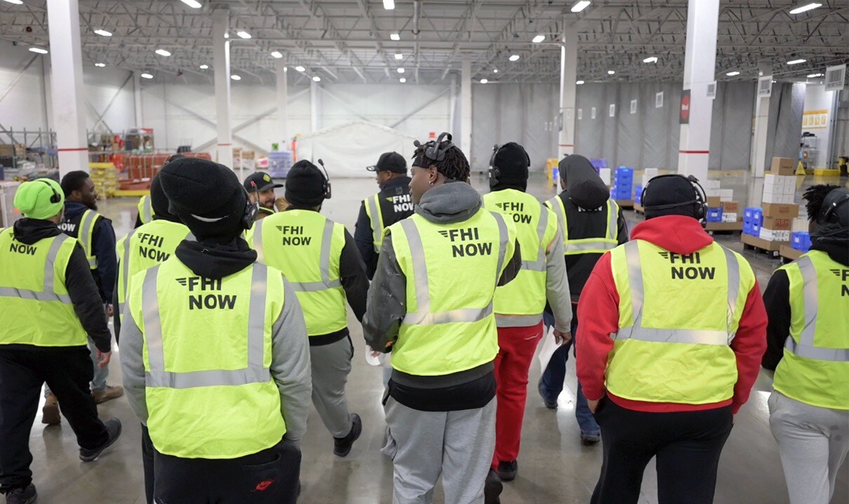 An image of FHI workers providing on-demand labor services at a warehouse.